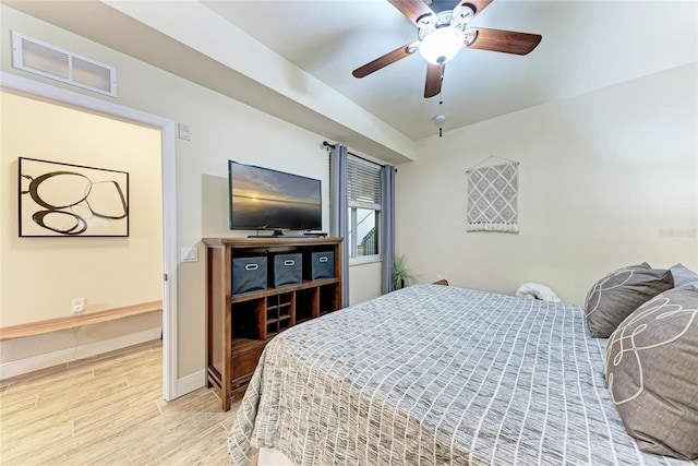 7911 Grand Estuary Trl Unit 102, Bradenton, FL 34212 - bedroom featuring light wood-type flooring, baseboards, and a ceiling fan