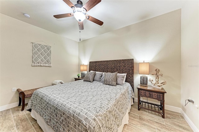 7911 Grand Estuary Trl Unit 102, Bradenton, FL 34212 - bedroom featuring baseboards and a ceiling fan