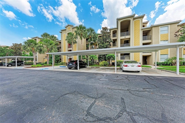 7911 Grand Estuary Trl Unit 102, Bradenton, FL 34212 - view of property with covered parking