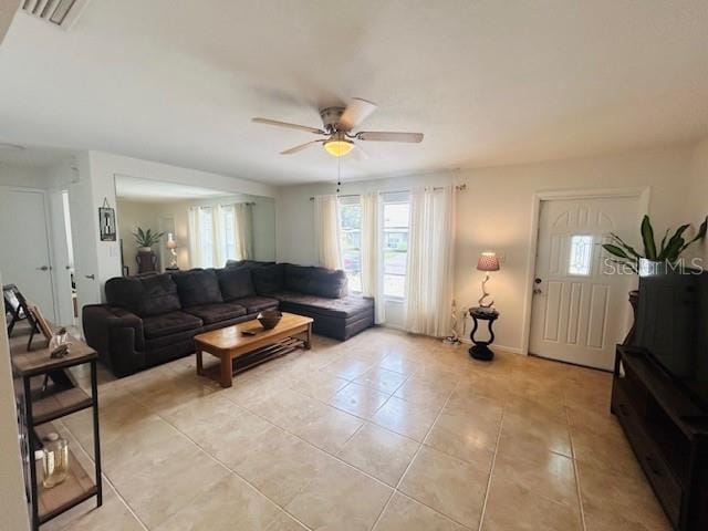 8409 43rd Ave W, Bradenton, FL 34209 - living area with ceiling fan, plenty of natural light, and light tile patterned floors