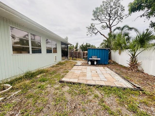 8409 43rd Ave W, Bradenton, FL 34209 - fenced backyard featuring a patio