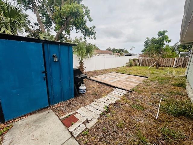 8409 43rd Ave W, Bradenton, FL 34209 - fenced backyard with a patio area
