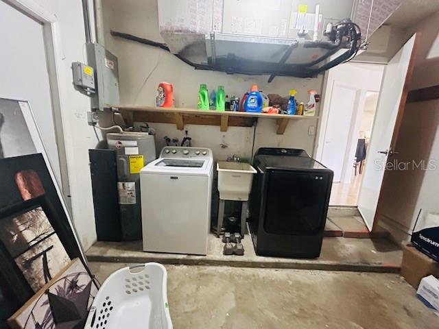 8409 43rd Ave W, Bradenton, FL 34209 - washroom with electric water heater and independent washer and dryer