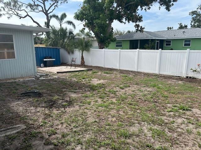 8409 43rd Ave W, Bradenton, FL 34209 - fenced backyard with a patio