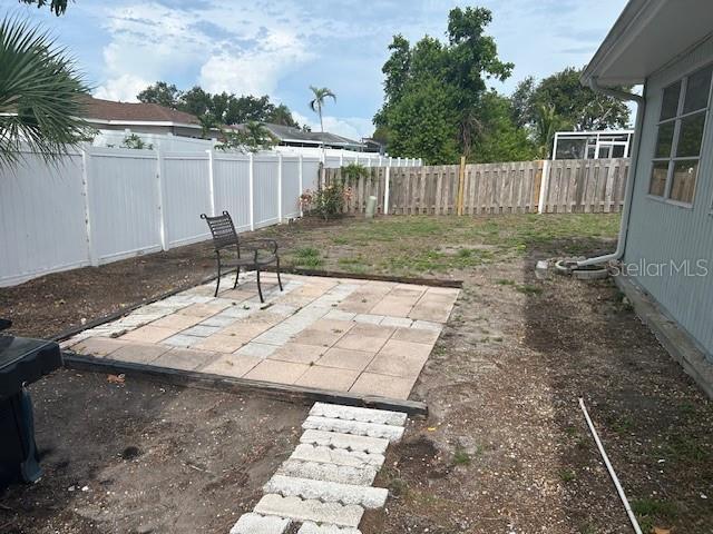 8409 43rd Ave W, Bradenton, FL 34209 - fenced backyard with a patio area