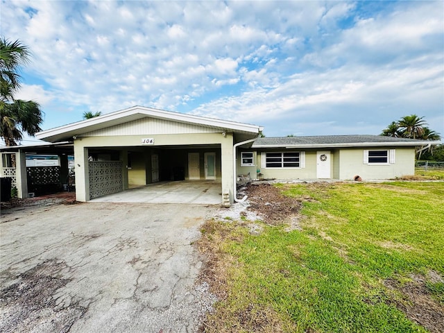 104 Pops Ln, Nokomis, FL 34275 - view of front of home with an attached garage, driveway, and a front yard