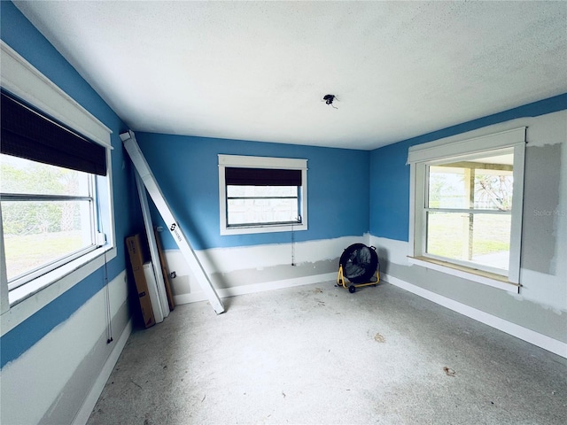 104 Pops Ln, Nokomis, FL 34275 - empty room featuring baseboards and a textured ceiling