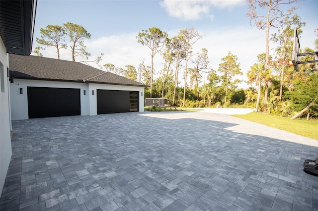 6713 Taneytown St, North Port, FL 34291 - garage featuring decorative driveway
