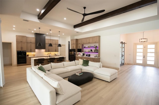 6713 Taneytown St, North Port, FL 34291 - living room with beamed ceiling, ceiling fan, recessed lighting, light wood-style floors, and baseboards
