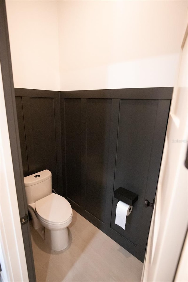 6713 Taneytown St, North Port, FL 34291 - bathroom with toilet and a wainscoted wall