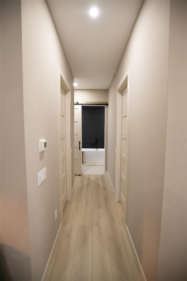 6713 Taneytown St, North Port, FL 34291 - hall with light wood-type flooring, baseboards, and recessed lighting