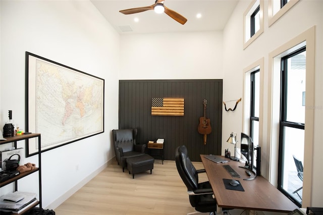 6713 Taneytown St, North Port, FL 34291 - office space with light wood finished floors, healthy amount of natural light, a towering ceiling, ceiling fan, and recessed lighting