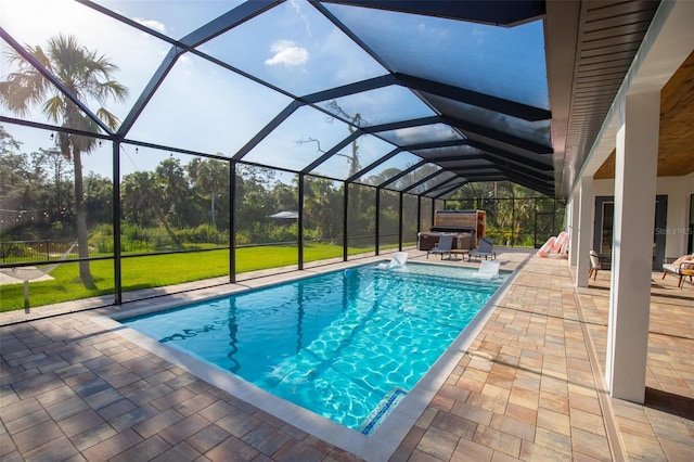 6713 Taneytown St, North Port, FL 34291 - outdoor pool featuring a patio, glass enclosure, and a yard
