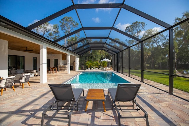 6713 Taneytown St, North Port, FL 34291 - outdoor pool featuring outdoor lounge area, a patio area, ceiling fan, and glass enclosure