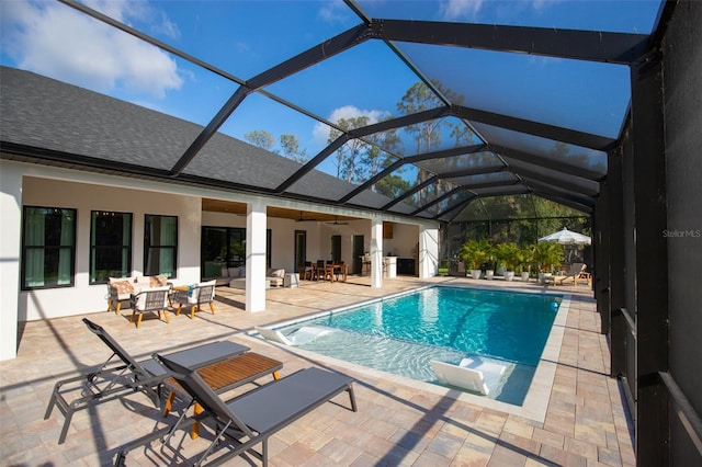 6713 Taneytown St, North Port, FL 34291 - outdoor pool with a patio area, a ceiling fan, glass enclosure, and an outdoor hangout area