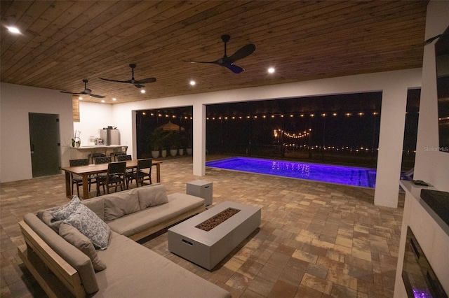 6713 Taneytown St, North Port, FL 34291 - patio at twilight featuring an outdoor living space with a fire pit, outdoor dining area, a patio area, and an outdoor pool