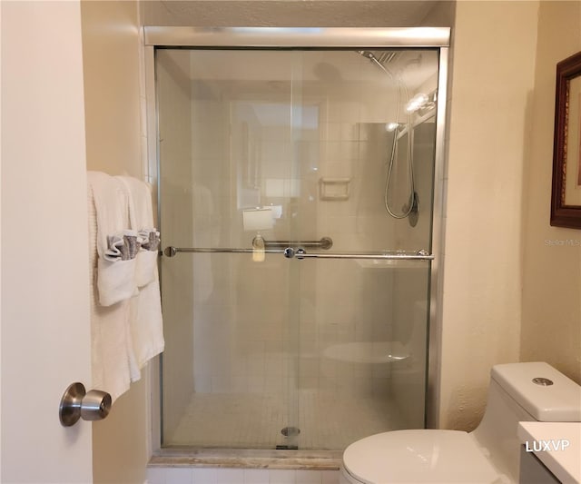 2124 N Tamiami Trl Unit 108, Sarasota, FL 34234 - bathroom with toilet, a shower stall, and vanity