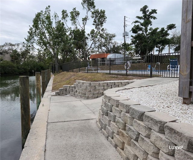 2124 N Tamiami Trl Unit 108, Sarasota, FL 34234 - view of home's community with a water view and a pool