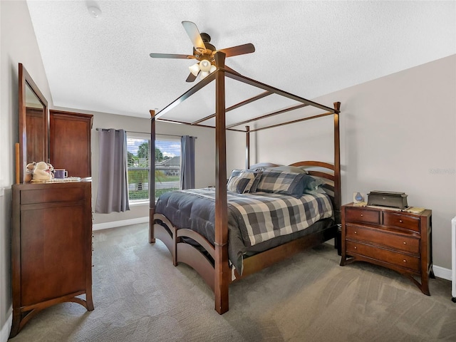27 Sea Shark Path, Palm Coast, FL 32164 - carpeted bedroom with a textured ceiling, baseboards, and ceiling fan
