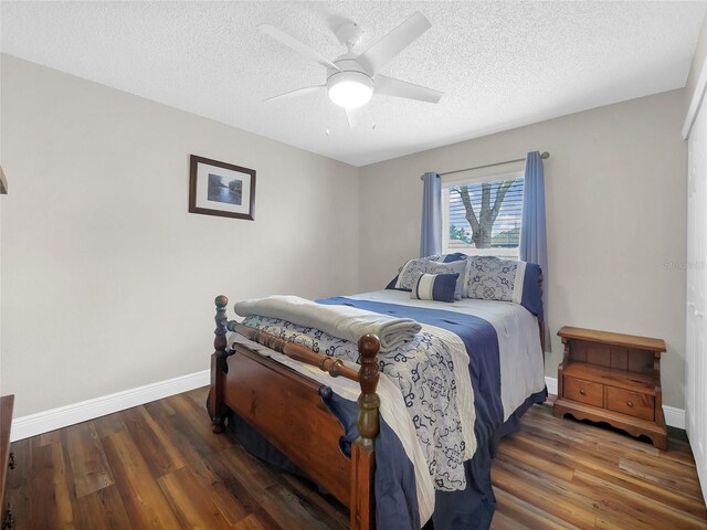 27 Sea Shark Path, Palm Coast, FL 32164 - bedroom with wood finished floors, baseboards, a textured ceiling, and ceiling fan