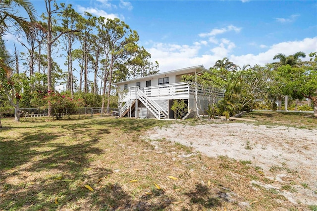 5403 Fleming St, Port Charlotte, FL 33981 - back of house with stairs and a wooden deck