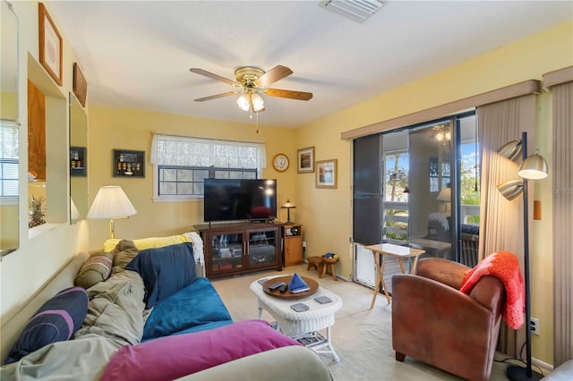 5403 Fleming St, Port Charlotte, FL 33981 - carpeted living area with a ceiling fan and healthy amount of natural light