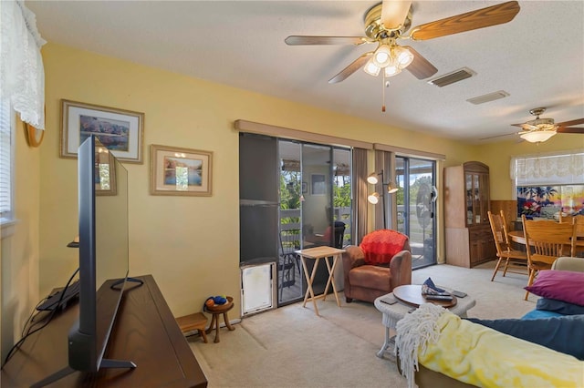 5403 Fleming St, Port Charlotte, FL 33981 - living area with carpet floors, ceiling fan, and a textured ceiling