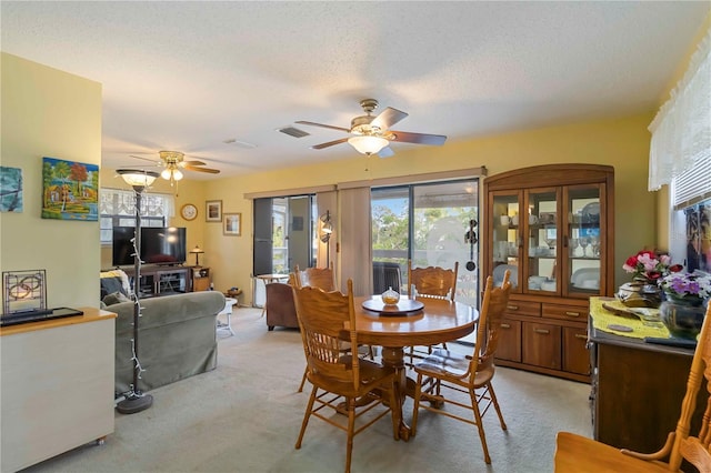 5403 Fleming St, Port Charlotte, FL 33981 - dining space with ceiling fan, light carpet, healthy amount of natural light, and a textured ceiling