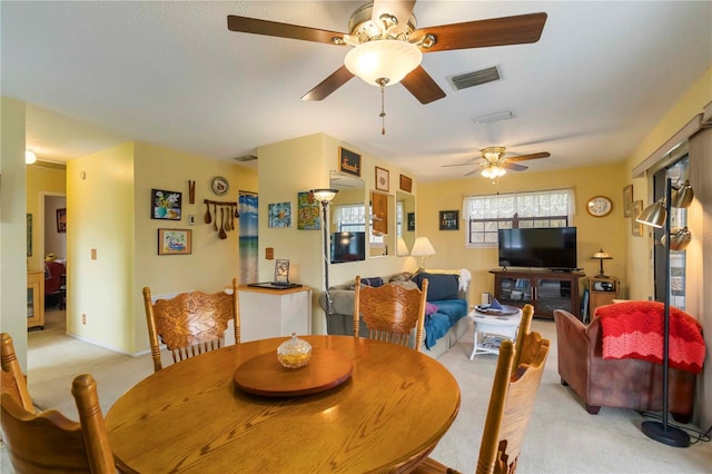 5403 Fleming St, Port Charlotte, FL 33981 - dining room with light colored carpet and a ceiling fan