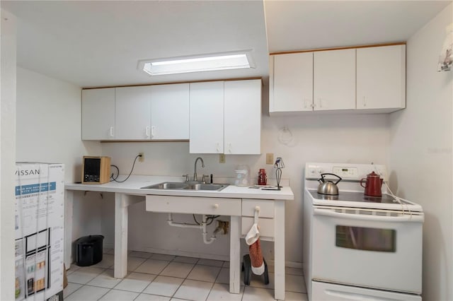 5403 Fleming St, Port Charlotte, FL 33981 - kitchen featuring white electric stove, a sink, light countertops, white cabinetry, and light tile patterned flooring