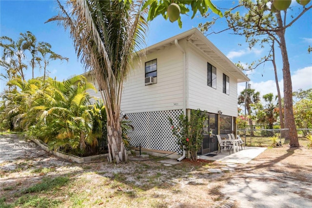 5403 Fleming St, Port Charlotte, FL 33981 - view of side of home featuring a patio and cooling unit