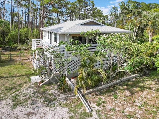 5403 Fleming St, Port Charlotte, FL 33981 - view of front of property featuring roof with shingles