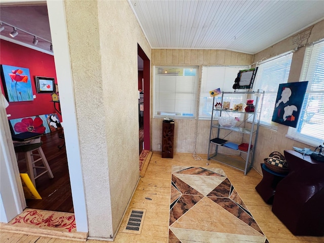 1019 10th Ave W, Bradenton, FL 34205 - hallway with wood finished floors, vaulted ceiling, and track lighting