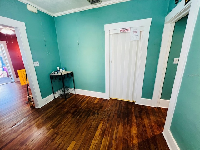 1019 10th Ave W, Bradenton, FL 34205 - empty room featuring wood finished floors, baseboards, and ornamental molding