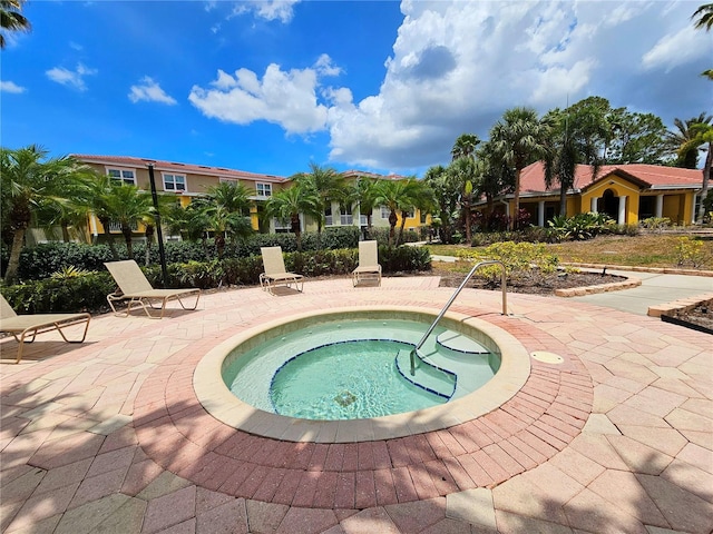 5711 Bentgrass Dr Unit 19-203, Sarasota, FL 34235 - view of swimming pool with a hot tub and a patio