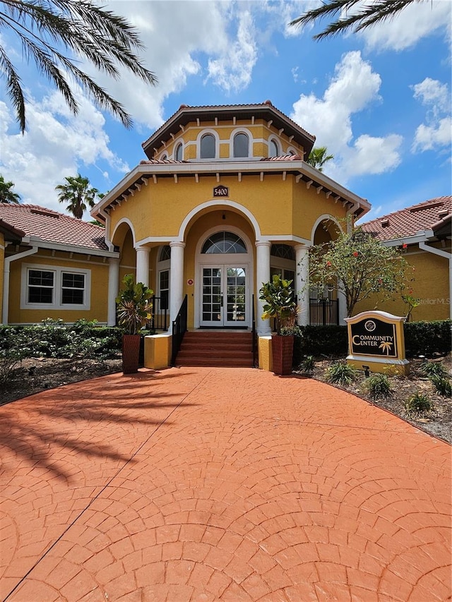 5711 Bentgrass Dr Unit 19-203, Sarasota, FL 34235 - mediterranean / spanish-style home with french doors and stucco siding