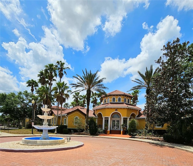5711 Bentgrass Dr Unit 19-203, Sarasota, FL 34235 - view of front of property with french doors and stucco siding