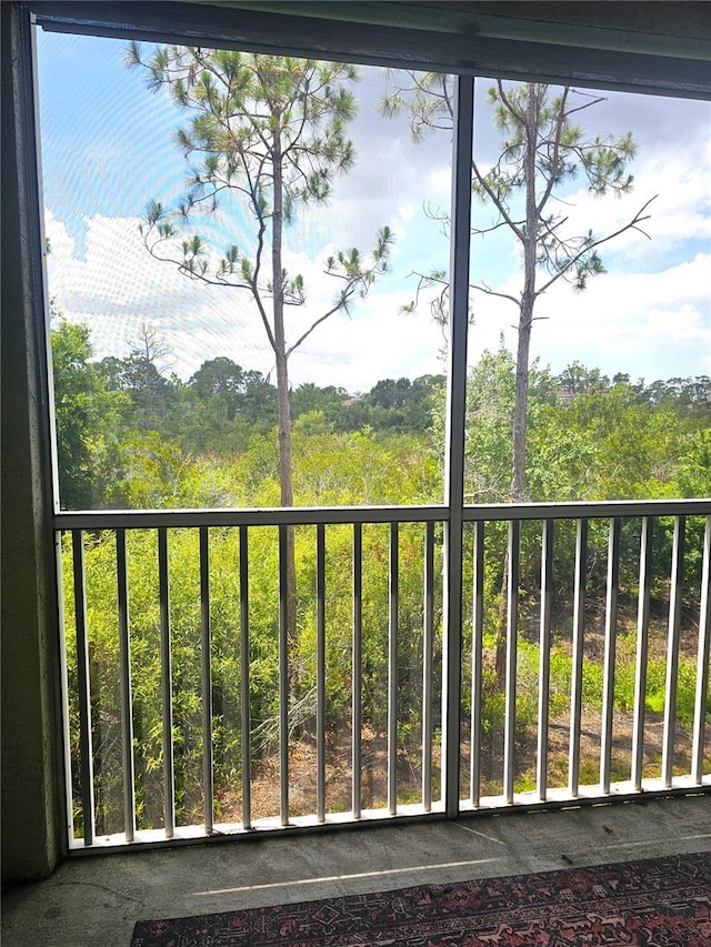 5711 Bentgrass Dr Unit 19-203, Sarasota, FL 34235 - balcony featuring a wooded view