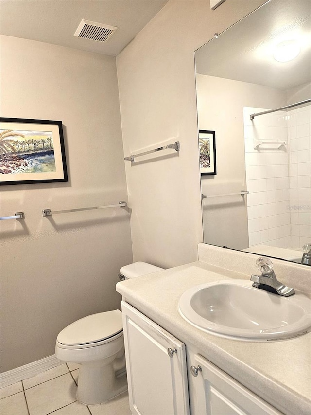 5711 Bentgrass Dr Unit 19-203, Sarasota, FL 34235 - full bath featuring vanity, toilet, a shower, tile patterned flooring, and baseboards