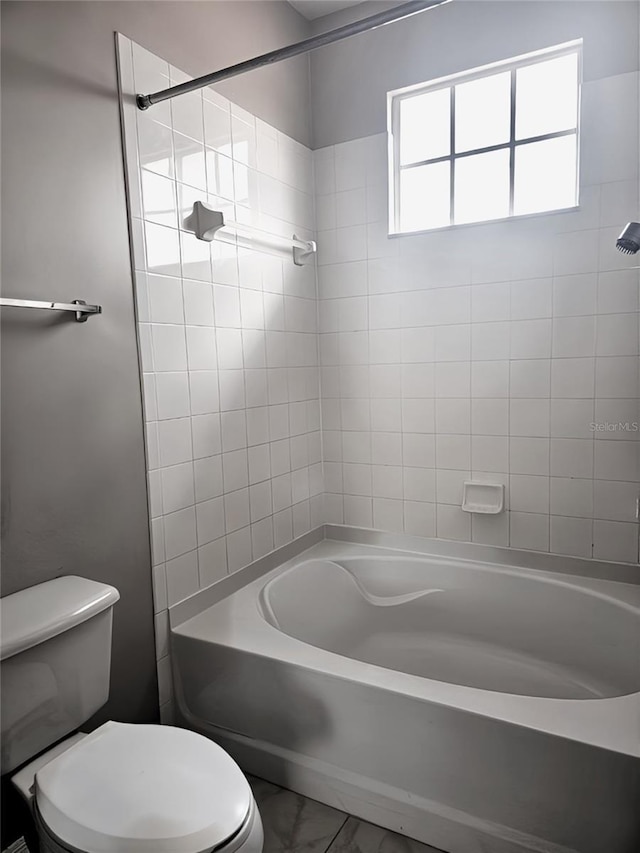 5711 Bentgrass Dr Unit 19-203, Sarasota, FL 34235 - bathroom featuring toilet, bathing tub / shower combination, and marble finish floors