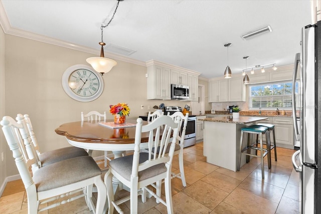 1723 Laramie St, Sarasota, FL 34231 - dining area with crown molding and light tile patterned floors