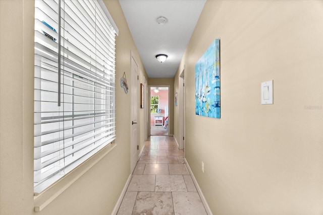 1723 Laramie St, Sarasota, FL 34231 - hall featuring baseboards and stone tile floors