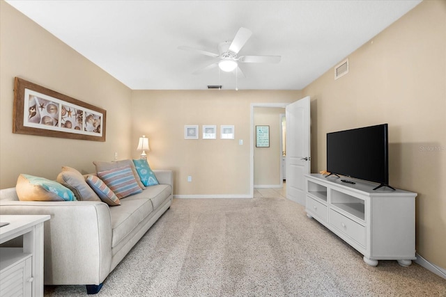 1723 Laramie St, Sarasota, FL 34231 - living area with a ceiling fan, baseboards, and light colored carpet