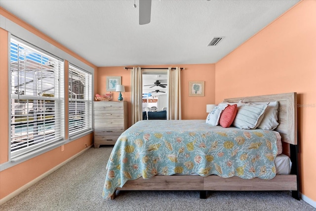 1723 Laramie St, Sarasota, FL 34231 - carpeted bedroom featuring baseboards, ceiling fan, and a textured ceiling