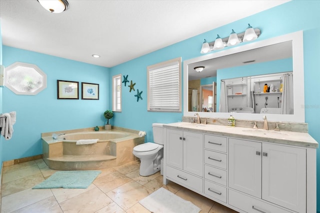 1723 Laramie St, Sarasota, FL 34231 - bathroom featuring a garden tub, double vanity, toilet, and baseboards