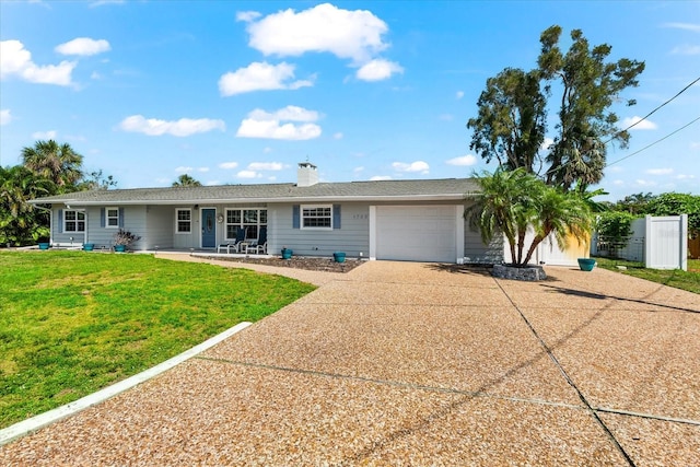 1723 Laramie St, Sarasota, FL 34231 - ranch-style house with a garage, concrete driveway, and a chimney