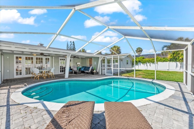 1723 Laramie St, Sarasota, FL 34231 - outdoor pool with a ceiling fan, an outdoor living space, french doors, a patio area, and glass enclosure