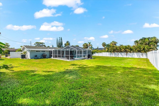1723 Laramie St, Sarasota, FL 34231 - view of yard featuring glass enclosure and central air condition unit