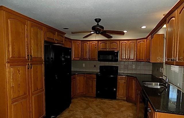 408 Fletcher St, Port Charlotte, FL 33954 - kitchen featuring black appliances, a sink, ceiling fan, brown cabinets, and recessed lighting