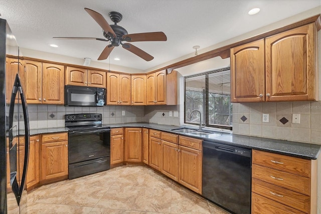 408 Fletcher St, Port Charlotte, FL 33954 - kitchen featuring black appliances, a sink, tasteful backsplash, brown cabinetry, and recessed lighting